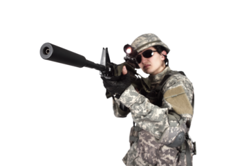 A soldier aims his rifle through a scope before firing