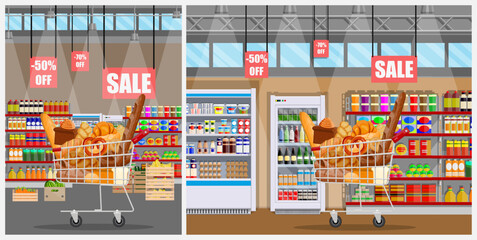 Shopping cart with food products in supermarket on sale. Grocery store interior with shelves, discount, and discount offer icon. Store, shop, market, concept.