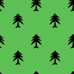 Fototapeta premium festive seamless Christmas pattern with silhouette pine trees on a vibrant green background, perfect for holiday designs and seasonal products.