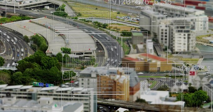 Showing aerial highway interchange curving over urban area, with vehicles, digital overlays - Powered by Adobe