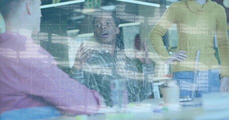 Colleague analyzing projected code on glass partition in office, holding white ceramic mug