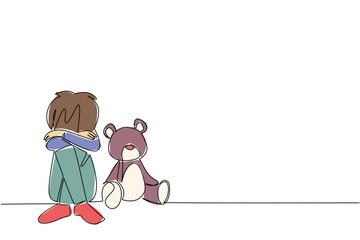 One line draw of a boy sitting beside teddy bear, symbolizing the pain and isolation of children in trauma, as a psychology concept for International Day of Innocent Children Victims of Aggression