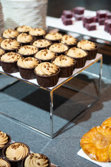 Catering banquet table with assorted snacks, desserts, pastries and appetizers, luxury food service arrangement for corporate event, wedding or festive celebration