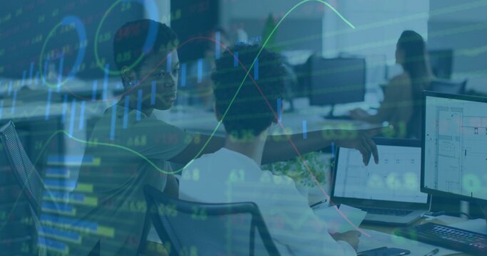 Collaborating women pointing at monitors and reviewing printouts at open plan office, with keyboard - Powered by Adobe