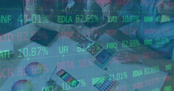 Designers leaning in comparing samples at meeting table, with swatch book, tablet and data overlay