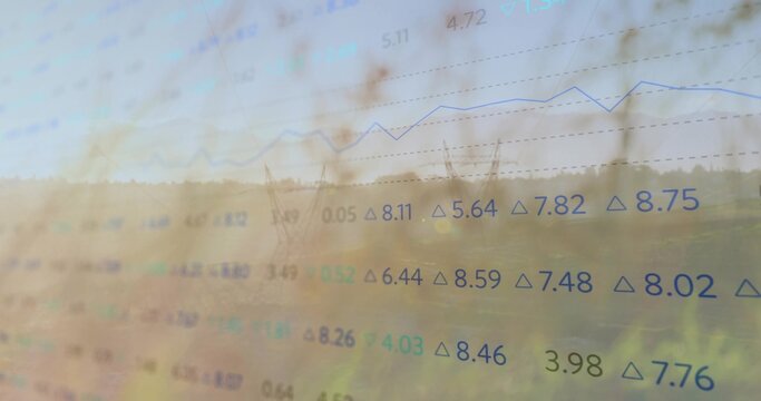 Displaying floating numeric figures and rising line graph over transmission towers in rural field - Powered by Adobe
