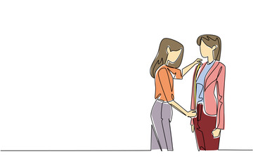 A woman tailor fits a jacket on female client in continuous line drawing style, representing business concept of fashion design, custom fitting, and skilled work for National Tailors Day.