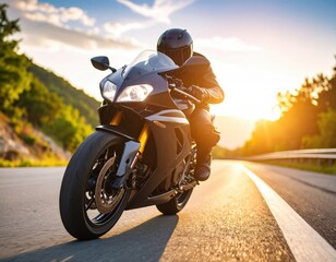 Motorcyclist rides sport bike on scenic highway during golden hour sunset with warm sunlight illuminating the road and countryside landscape.