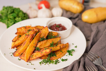 baked potatoes with paprika and garlic, topped with fresh parsley and rich tomato sauce an irresistible homemade dish served fresh from the oven.