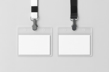 Empty identification name badges with black and white lanyards on a clean gray background, ideal for mockups and branding.