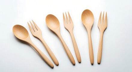 Wooden Spoons and Forks on White Background.