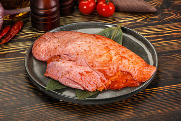 Raw marinated duck breast for cooking