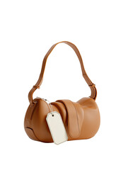 Beige handbag with soft, rounded form and a tag