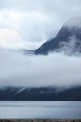 Tranquil Lake Landscape with Floating Fog