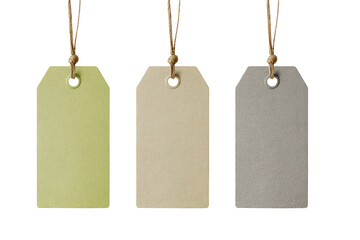 Three blank paper tags, light yellowish-green, beige, and gray-beige, hang from light brown string.  Each tag has a small metal eyelet and knotted string