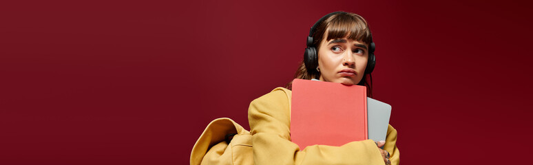 Young woman studies in cozy environment with headphones for focused learning and creativity