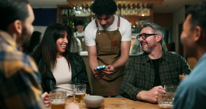 Customer, payment and people in pub with phone, friends and online transfer in pos system. Fintech, mobile and waiter in bar with drinks, group checkout and wireless transaction in electronic banking