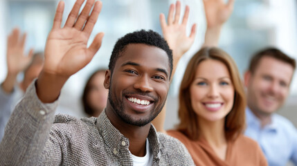 Diverse group in engaging meeting with participants actively raising hands in a collaborative environment