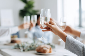 People at the festive table raised their glasses