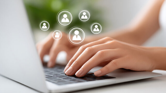 Collaborative business networking concept with hands typing on laptop featuring people icons for digital communication and connection