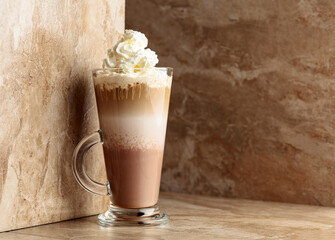 Layered chocolate cocktail with whipped cream.