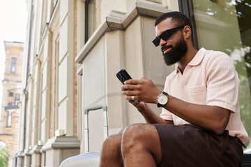 Exploring a vibrant city, a stylish traveler embraces the joy of discovery