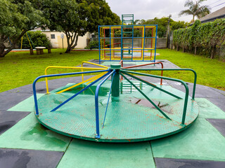 Public children's playground park on a cloudy day