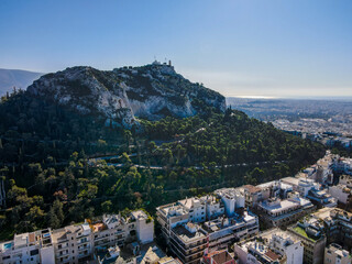 Aerial landscape from ancient Lycabettus Hill monument winter sunset Mediterranean Athens