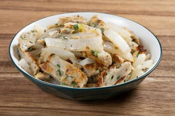 angle view home style pan-fried fish cakes with white radish