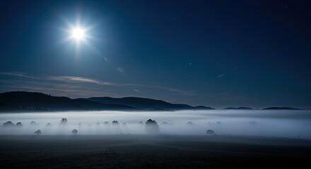 Scenic Moonlit Landscape with Rolling Fog and Dark Blue Sky