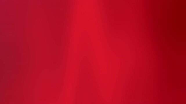 Abstract animated background featuring smooth flowing gradient in vibrant red tones from crimson to burgundy.