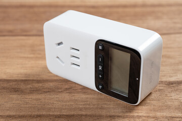 Obraz premium a digital timer plug with control buttons