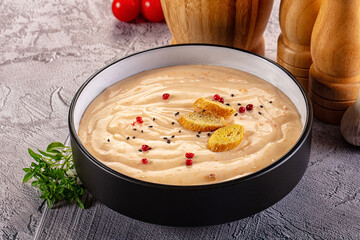 Tasty cheese cream soup with crouton