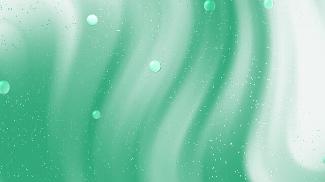 Teal bubbles and water droplets on glass  ideal for spa, wellness, or nature themed designs, posters, and backgrounds.