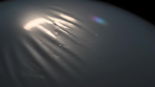 Metallic balloon macro with migrating creases and panning highlights
