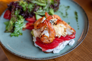 Healthy breakfast. Toast with seafood and vegetable salad