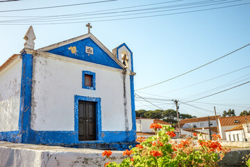 Old church façade and bell tower in an Óbidos village, Portugal