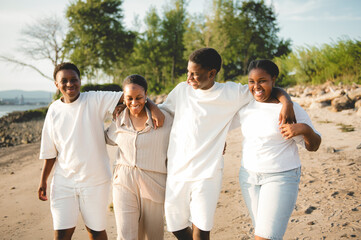 Portrait of big black family on beach at the sunset