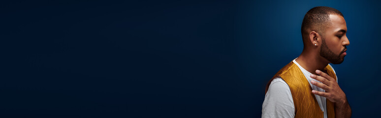 Stylish young african american man showcasing fashion sense in a vibrant setting