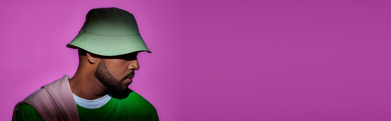 Stylish young african american man rocking a trendy outfit against a vibrant background