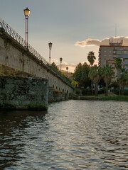 Stone bridge over the Tua River in Mirandela, Portugal, with granite arches and pedestrian use. August 2025, peaceful historic landmark connecting old city sides.