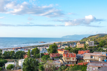 Obraz premium Small village with morning in state of Jijel, Algeria, rural village, A beautiful Mediterranean village in North Africa, Algeria from above, A small town overlooking the Mediterranean sea.