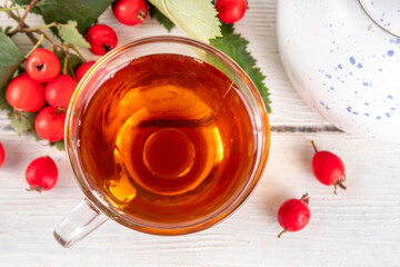 Fragrant autumn hawthorn berry tea. Herbal organic hot drink made from wild forest hawthorn...