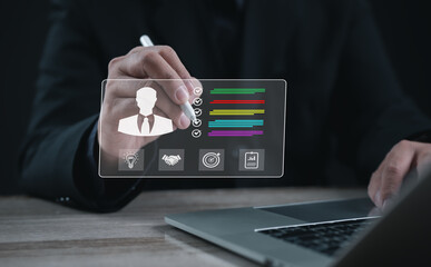 Professional reviewing digital profile performance on laptop with virtual checklist and analytics icons. Concept of human resources, employee evaluation, management, and career development technology.