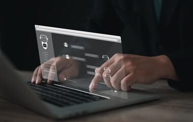 Businessman using laptop with virtual chatbot AI interface, online conversation, and digital assistant. Concept of artificial intelligence, customer support, and future technology innovation.