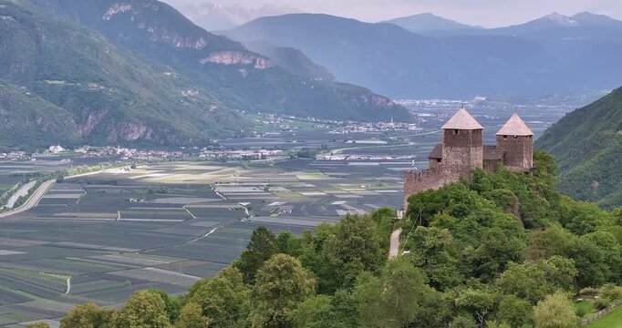 Drone view over Etschtal valley with historic building foreground