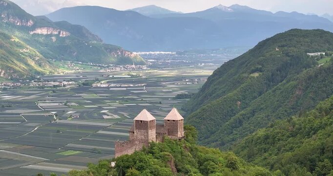 Drone view over Etschtal valley with historic building foreground