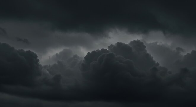 Dark, ominous storm clouds gathering in a turbulent and dramatic sky before a thunderstorm.
