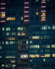 Modern Office Building at Night – Illuminated Windows in City Skyscraper