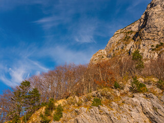 bright autumn landscape, view of the Austrian Alps. road to Italy on sunny day.